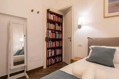 Letto o letti in una camera di Palazzo Guida al Duomo
