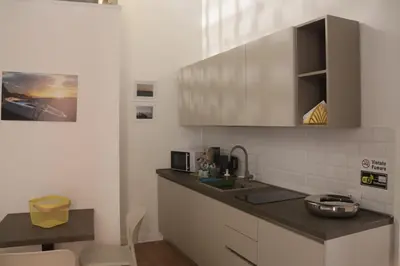 Cucina o angolo cottura di La Gioia di Napoli apartment & studios
