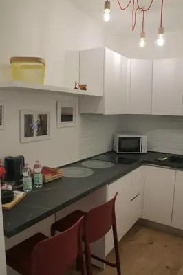 Cucina o angolo cottura di La Gioia di Napoli apartment & studios