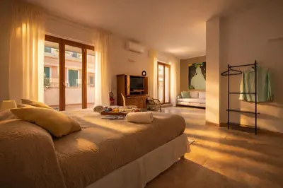 Letto o letti in una camera di Molo Angioino Suites