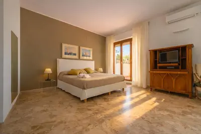 Letto o letti in una camera di Molo Angioino Suites