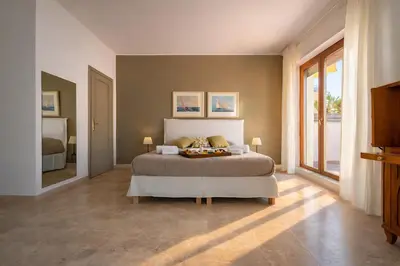 Letto o letti in una camera di Molo Angioino Suites