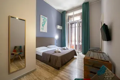 Letto o letti in una camera di GreRos Boutique H Angioino, by ClaPa Group Dislocate Hospitality