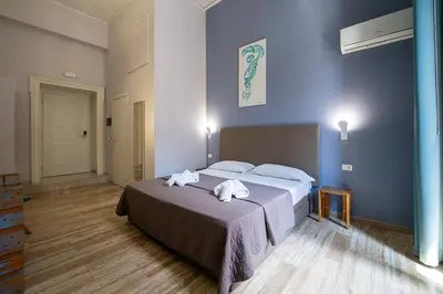 Letto o letti in una camera di GreRos Boutique H Angioino, by ClaPa Group Dislocate Hospitality