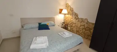 Letto o letti in una camera di Basso Home a Spaccanapoli