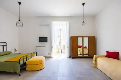 Letto o letti in una camera di Holme Relais Santa Lucia by NapoliApartments