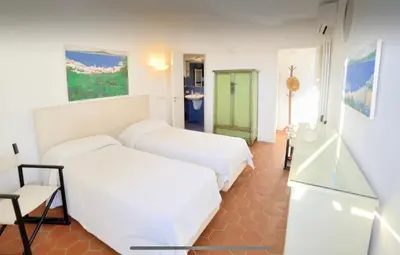 Letto o letti in una camera di Le terrazze di Chiaia