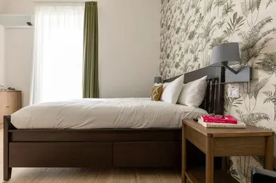 Letto o letti in una camera di Riviera Collection - Rooms and Suites