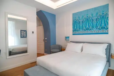Letto o letti in una camera di 4ROOMS Naples