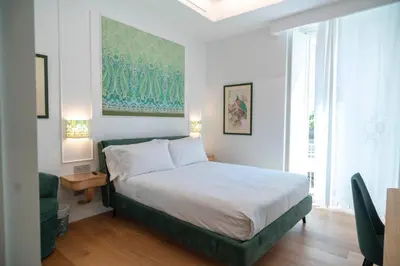 Letto o letti in una camera di 4ROOMS Naples
