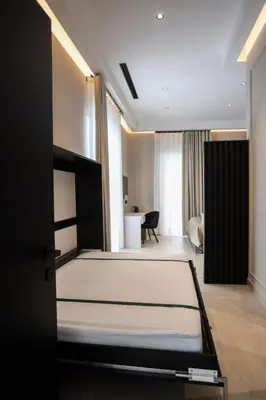 Letto o letti in una camera di LUNA Gallery Suites