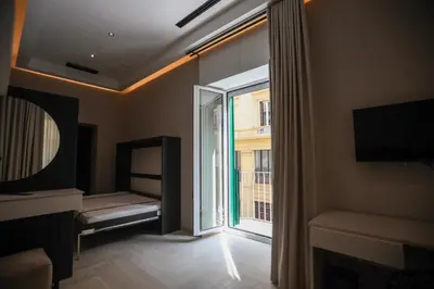 Letto o letti in una camera di LUNA Gallery Suites