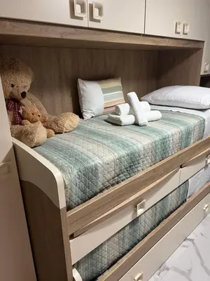 Letto o letti in una camera di Napoli City