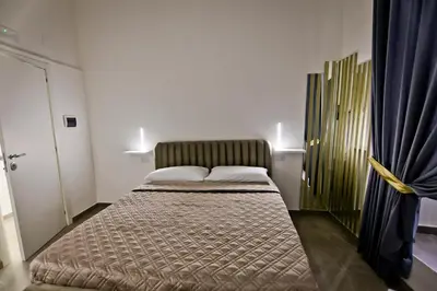 Letto o letti in una camera di Dante Luxury Rooms