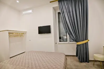 TV o dispositivi per l'intrattenimento presso Dante Luxury Rooms