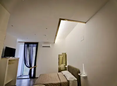 TV o dispositivi per l'intrattenimento presso Dante Luxury Rooms