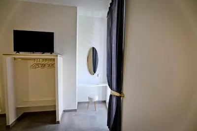 TV o dispositivi per l'intrattenimento presso Dante Luxury Rooms