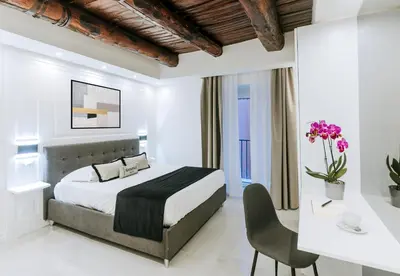 Letto o letti in una camera di Gentile Suite Decumani