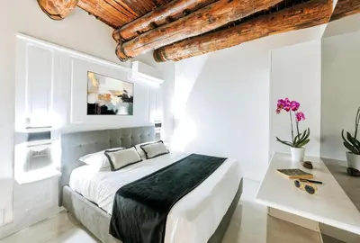 Letto o letti in una camera di Gentile Suite Decumani