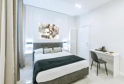 Letto o letti in una camera di Gentile Suite Decumani