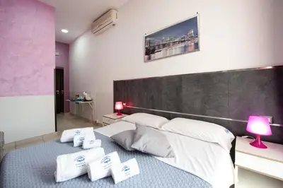 Letto o letti in una camera di Napolì 2 Affittacamere