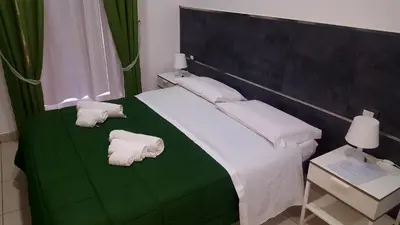 Letto o letti in una camera di Napolì 2 Affittacamere