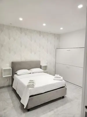 Letto o letti in una camera di casa margherita