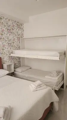Letto o letti in una camera di casa margherita