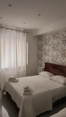 Letto o letti in una camera di casa margherita