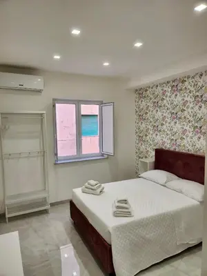 Letto o letti in una camera di casa margherita