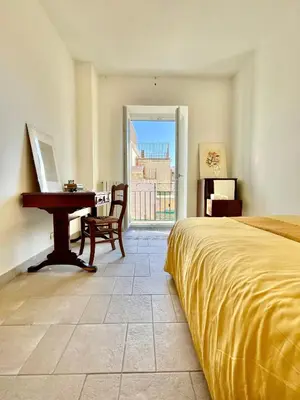 Letto o letti in una camera di SANTA MADRE NAPOLI penthouse