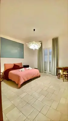 Letto o letti in una camera di SANTA MADRE NAPOLI penthouse