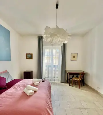 Letto o letti in una camera di SANTA MADRE NAPOLI penthouse