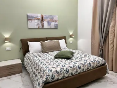 Letto o letti in una camera di B&B Nanu Napoli centro