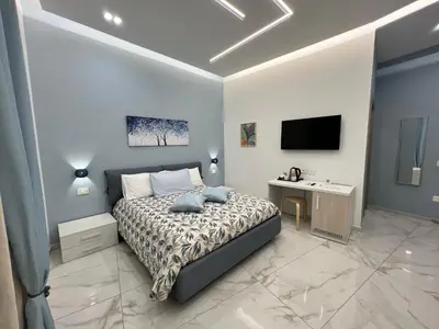 Letto o letti in una camera di B&B Nanu Napoli centro