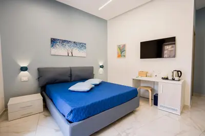 Letto o letti in una camera di B&B Nanu Napoli centro