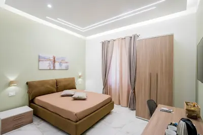Letto o letti in una camera di B&B Nanu Napoli centro