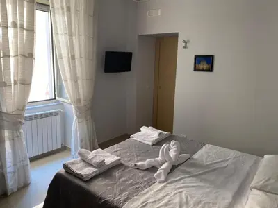 Letto o letti in una camera di Dimora Melania