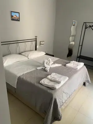 Letto o letti in una camera di Dimora Melania