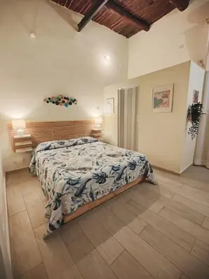 Letto o letti in una camera di Neathea Napoli