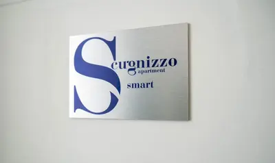 Certificato, attestato, insegna o altro documento esposto da Scugnizzo Apartment SMART