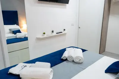 Letto o letti in una camera di Scugnizzo Apartment SMART