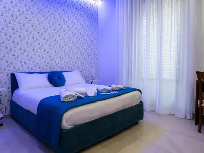 Letto o letti in una camera di B&B Marinella