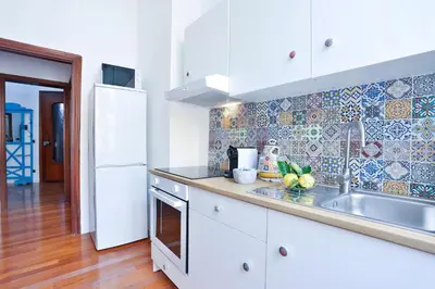 Cucina o angolo cottura di GuestHost - La Casa del Presepe Central House