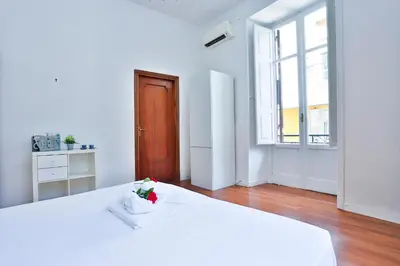 Letto o letti in una camera di GuestHost - La Casa del Presepe Central House