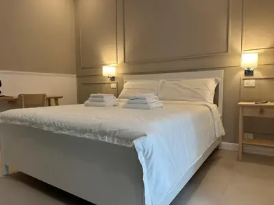 Letto o letti in una camera di Terrazza Carbonara B&B