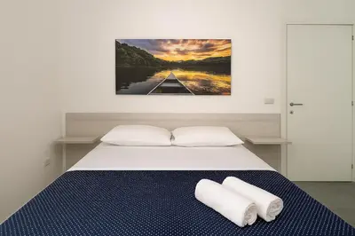 Letto o letti in una camera di GG-ROOM - San Giovanni