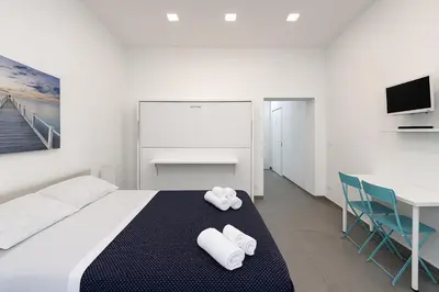Letto o letti in una camera di GG-ROOM - San Giovanni