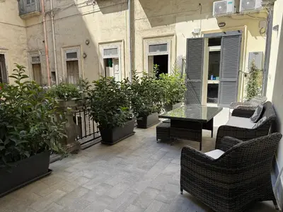 Area soggiorno di Al San Carlo Rooms