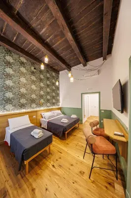 Letto o letti in una camera di The Tribunali Apartments By HouseinNaples
